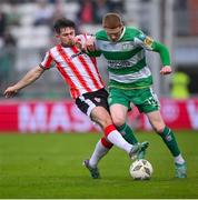20 May 2024; Darragh Nugent of Shamrock Rovers is tackled by Adam O'Reilly of Derry City during the SSE Airtricity Men's Premier Division match between Shamrock Rovers and Derry City at Tallaght Stadium in Dublin. Photo by Ramsey Cardy/Sportsfile
