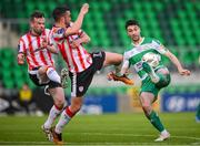 20 May 2024; Neil Farrugia of Shamrock Rovers in action against Cameron Dummigan, left, and Michael Duffy of Derry City during the SSE Airtricity Men's Premier Division match between Shamrock Rovers and Derry City at Tallaght Stadium in Dublin. Photo by Ramsey Cardy/Sportsfile