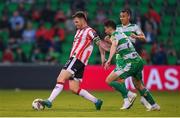 20 May 2024; Cameron McJannet of Derry City in action against Neil Farrugia of Shamrock Rovers during the SSE Airtricity Men's Premier Division match between Shamrock Rovers and Derry City at Tallaght Stadium in Dublin. Photo by Shauna Clinton/Sportsfile