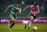 20 May 2024; Neil Farrugia of Shamrock Rovers in action against Cameron McJannet of Derry City during the SSE Airtricity Men's Premier Division match between Shamrock Rovers and Derry City at Tallaght Stadium in Dublin. Photo by Shauna Clinton/Sportsfile