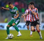 20 May 2024; Graham Burke of Shamrock Rovers in action against Adam O'Reilly of Derry City during the SSE Airtricity Men's Premier Division match between Shamrock Rovers and Derry City at Tallaght Stadium in Dublin. Photo by Shauna Clinton/Sportsfile