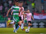 20 May 2024; Graham Burke of Shamrock Rovers in action against Sam Todd of Derry City during the SSE Airtricity Men's Premier Division match between Shamrock Rovers and Derry City at Tallaght Stadium in Dublin. Photo by Shauna Clinton/Sportsfile