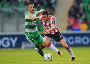 20 May 2024; Michael Duffy of Derry City in action against Graham Burke of Shamrock Rovers during the SSE Airtricity Men's Premier Division match between Shamrock Rovers and Derry City at Tallaght Stadium in Dublin. Photo by Shauna Clinton/Sportsfile