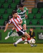 20 May 2024; Trevor Clarke of Shamrock Rovers in action against Adam O'Reilly of Derry City during the SSE Airtricity Men's Premier Division match between Shamrock Rovers and Derry City at Tallaght Stadium in Dublin. Photo by Shauna Clinton/Sportsfile