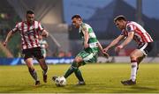20 May 2024; Aaron Greene of Shamrock Rovers in action against Michael Duffy, left, and Cameron McJannet of Derry City during the SSE Airtricity Men's Premier Division match between Shamrock Rovers and Derry City at Tallaght Stadium in Dublin. Photo by Shauna Clinton/Sportsfile