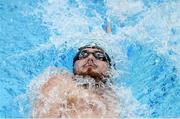 22 May 2024; Barry McClements of NCU A competes in the Men's 100m Backstroke Finals during day one of the Ireland Olympic Swimming Trials at the National Aquatic Centre on the Sport Ireland Campus in Dublin. Photo by Shauna Clinton/Sportsfile