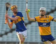 20 May 2024; Eoghan Doughan of Tipperary in action against Ryan Hayes of Clare during the Electric Ireland Munster GAA Hurling Minor Championship Final match between Clare and Tipperary at TUS Gaelic Grounds in Limerick. Photo by Matt Browne/Sportsfile