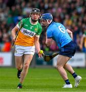22 May 2024; Cathal King of Offaly passes under pressure from Conor Dolan of Dublin during the oneills.com Leinster GAA Hurling U20 Championship final match between Dublin and Offaly at Laois Hire O'Moore Park in Portlaoise, Laois. Photo by Ray McManus/Sportsfile