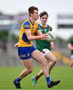 24 May 2024; Darragh Devaney of Roscommon in action against Mark Sheeran of Mayo during the Connacht GAA Football Minor Championship final match between Mayo and Roscommon at Dr Hyde Park in Roscommon. Photo by Stephen Marken/Sportsfile