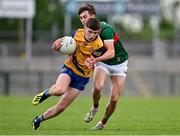 24 May 2024; Dean Casey of Roscommon in action against Josh Moyles of Mayo during the Connacht GAA Football Minor Championship final match between Mayo and Roscommon at Dr Hyde Park in Roscommon. Photo by Stephen Marken/Sportsfile