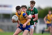 24 May 2024; Dean Casey of Roscommon in action against Mark Sheeran of Mayo during the Connacht GAA Football Minor Championship final match between Mayo and Roscommon at Dr Hyde Park in Roscommon. Photo by Stephen Marken/Sportsfile