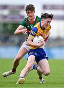 24 May 2024; Eoin Collins of Roscommon in action against Josh Moyles of Mayo during the Connacht GAA Football Minor Championship final match between Mayo and Roscommon at Dr Hyde Park in Roscommon. Photo by Stephen Marken/Sportsfile