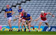 24 May 2024; Mason Cawley of Tipperary in action against Hugh O'Connor, left, and David Cremin of Cork during the oneills.com Munster GAA U20 Hurling Championship final match between Tipperary and Cork at TUS Gaelic Grounds in Limerick. Photo by Ben McShane/Sportsfile