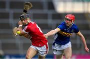 24 May 2024; Mikey Finn of Cork in action against Cathal English of Tipperary during the oneills.com Munster GAA U20 Hurling Championship final match between Tipperary and Cork at TUS Gaelic Grounds in Limerick. Photo by Ben McShane/Sportsfile