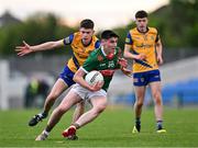 24 May 2024; Andrew Quinn of Mayo in action against Gordon Casey of Roscommon during the Connacht GAA Football Minor Championship final match between Mayo and Roscommon at Dr Hyde Park in Roscommon. Photo by Stephen Marken/Sportsfile
