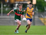 24 May 2024; David Hurley of Mayo in action against Dean Casey of Roscommon during the Connacht GAA Football Minor Championship final match between Mayo and Roscommon at Dr Hyde Park in Roscommon. Photo by Stephen Marken/Sportsfile