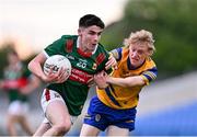 24 May 2024; Andrew Quinn of Mayo in action against Declan Kennedy of Roscommon during the Connacht GAA Football Minor Championship final match between Mayo and Roscommon at Dr Hyde Park in Roscommon. Photo by Stephen Marken/Sportsfile