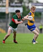 24 May 2024; Declan Kennedy of Roscommon in action against Evan Walsh of Mayo during the Connacht GAA Football Minor Championship final match between Mayo and Roscommon at Dr Hyde Park in Roscommon. Photo by Stephen Marken/Sportsfile