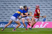 24 May 2024; Hugh O'Connor of Cork in action against Mason Cawley, centre, and Aaron O'Halloran of Tipperary during the oneills.com Munster GAA U20 Hurling Championship final match between Tipperary and Cork at TUS Gaelic Grounds in Limerick. Photo by Ben McShane/Sportsfile