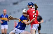 24 May 2024; Oisin O'Donoghue of Tipperary is tackled by Denis Cashman of Cork during the oneills.com Munster GAA U20 Hurling Championship final match between Tipperary and Cork at TUS Gaelic Grounds in Limerick. Photo by Ben McShane/Sportsfile