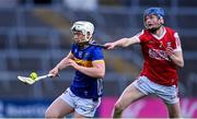 24 May 2024; Darragh McCarthy of Tipperary in action against Denis Cashman of Cork during the oneills.com Munster GAA U20 Hurling Championship final match between Tipperary and Cork at TUS Gaelic Grounds in Limerick. Photo by Ben McShane/Sportsfile