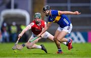 24 May 2024; James Dwyer of Cork wins possession ahead of Mason Cawley of Tipperary during the oneills.com Munster GAA U20 Hurling Championship final match between Tipperary and Cork at TUS Gaelic Grounds in Limerick. Photo by Ben McShane/Sportsfile