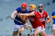 24 May 2024; Cathal English of Tipperary is tackled by Cillian Tobin of Cork during the oneills.com Munster GAA U20 Hurling Championship final match between Tipperary and Cork at TUS Gaelic Grounds in Limerick. Photo by Ben McShane/Sportsfile