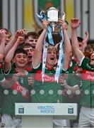 24 May 2024; Mayo captain David Hurley lifts the The Tom Kilcoyne Cup after the Connacht GAA Football Minor Championship final match between Mayo and Roscommon at Dr Hyde Park in Roscommon. Photo by Stephen Marken/Sportsfile