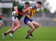 24 May 2024; David Hurley of Mayo in action against Gordon Casey of Roscommon during the Connacht GAA Football Minor Championship final match between Mayo and Roscommon at Dr Hyde Park in Roscommon. Photo by Stephen Marken/Sportsfile