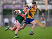 24 May 2024; David Hurley of Mayo in action against Gordon Casey of Roscommon during the Connacht GAA Football Minor Championship final match between Mayo and Roscommon at Dr Hyde Park in Roscommon. Photo by Stephen Marken/Sportsfile