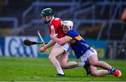 24 May 2024; Kevin Lyons of Cork is tackled by Darragh McCarthy of Tipperary during the oneills.com Munster GAA U20 Hurling Championship final match between Tipperary and Cork at TUS Gaelic Grounds in Limerick. Photo by Ben McShane/Sportsfile