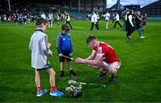 24 May 2024; Hugh O'Connor of Cork signs an autograph for supporters after his side's defeat in the oneills.com Munster GAA U20 Hurling Championship final match between Tipperary and Cork at TUS Gaelic Grounds in Limerick. Photo by Ben McShane/Sportsfile