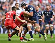 25 May 2024; Caelan Doris of Leinster in action against Matthis Lebel, 11, and Peato Mauvaka of Toulouse during the Investec Champions Cup final between Leinster and Toulouse at the Tottenham Hotspur Stadium in London, England. Photo by Sam Barnes/Sportsfile