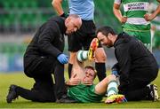 24 May 2024; Daniel Cleary of Shamrock Rovers receives medical attention from Shamrock Rovers physiotherapist Tony McCarthy and team doctor Connor Gallagher, right, during the SSE Airtricity Men's Premier Division match between Shamrock Rovers and Shelbourne at Tallaght Stadium in Dublin. Photo by Stephen McCarthy/Sportsfile
