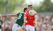 25 May 2024; Anthony Williams of Louth in action against Ronan Jones of Meath during the GAA Football All-Ireland Senior Championship Round 1 match between Louth and Meath at Grattan Park in Inniskeen, Monaghan. Photo by Daire Brennan/Sportsfile