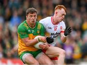 25 May 2024; Peadar Mogan of Donegal is tackled by Sean O’Donnell of Tyrone during the GAA Football All-Ireland Senior Championship Round 1 match between Donegal and Tyrone at MacCumhaill Park in Ballybofey, Donegal. Photo by Stephen McCarthy/Sportsfile