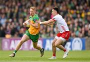 25 May 2024; Oisin Gallen of Donegal in action against Padraig Hampsey of Tyrone during the GAA Football All-Ireland Senior Championship Round 1 match between Donegal and Tyrone at MacCumhaill Park in Ballybofey, Donegal. Photo by Stephen McCarthy/Sportsfile