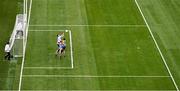 25 May 2024; Dublin goalkeeper Stephen Cluxton punches the ball clear of team mate Michael Fitzsimons and Conor Cox of Roscommon during the GAA Football All-Ireland Senior Championship Round 1 match between Dublin and Roscommon at Croke Park in Dublin. Photo by Ray McManus/Sportsfile