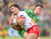 25 May 2024; Michael McKernan of Tyrone is tackled by Niall O'Donnell of Donegal during the GAA Football All-Ireland Senior Championship Round 1 match between Donegal and Tyrone at MacCumhaill Park in Ballybofey, Donegal. Photo by Stephen McCarthy/Sportsfile