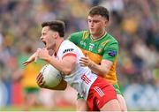 25 May 2024; Michael McKernan of Tyrone is tackled by Niall O'Donnell of Donegal during the GAA Football All-Ireland Senior Championship Round 1 match between Donegal and Tyrone at MacCumhaill Park in Ballybofey, Donegal. Photo by Stephen McCarthy/Sportsfile