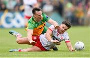 25 May 2024; Michael McKernan of Tyrone in action against Jason McGee of Donegal during the GAA Football All-Ireland Senior Championship Round 1 match between Donegal and Tyrone at MacCumhaill Park in Ballybofey, Donegal. Photo by Stephen McCarthy/Sportsfile