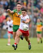25 May 2024; Michael McKernan of Tyrone in action against Jason McGee of Donegal during the GAA Football All-Ireland Senior Championship Round 1 match between Donegal and Tyrone at MacCumhaill Park in Ballybofey, Donegal. Photo by Stephen McCarthy/Sportsfile
