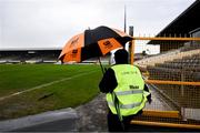 26 May 2024; A 'Maor' heads to her post in driving rain before  the Leinster GAA Hurling Senior Championship Round 5 match between Kilkenny and Wexford at UPMC Nowlan Park in Kilkenny. Photo by Ray McManus/Sportsfile