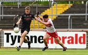 26 May 2024; Keelan McEntee of Armagh in action against Dylan Rocks of Derry during the Electric Ireland Ulster GAA Football Minor Championship final match between Armagh and Derry at O'Neill's Healy Park in Omagh, Tyrone. Photo by Philip Fitzpatrick/Sportsfile