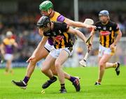 26 May 2024; Tom Phelan of Kilkenny is tackled by Matthew O'Hanlon of Wexford during the Leinster GAA Hurling Senior Championship Round 5 match between Kilkenny and Wexford at UPMC Nowlan Park in Kilkenny. Photo by Ray McManus/Sportsfile