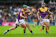 26 May 2024; Richie Lawlor of Wexford is tackled by Paddy Deegan of Kilkenny during the Leinster GAA Hurling Senior Championship Round 5 match between Kilkenny and Wexford at UPMC Nowlan Park in Kilkenny. Photo by Ray McManus/Sportsfile