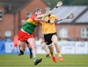 26 May 2024; Niall McKenna of Antrim is tackled by Tony Lawlor of Carlow during the Leinster GAA Hurling Senior Championship Round 5 match between Antrim and Carlow at Corrigan Park in Belfast. Photo by Shauna Clinton/Sportsfile