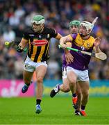 26 May 2024; Paddy Deegan of Kilkenny in action against Cathal Dunbar and Richie Lawlor of Wexford during the Leinster GAA Hurling Senior Championship Round 5 match between Kilkenny and Wexford at UPMC Nowlan Park in Kilkenny. Photo by Ray McManus/Sportsfile