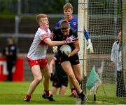 26 May 2024; Keelan McEntee of Armagh in action against Daithi O'Callaghan of Derry during the Electric Ireland Ulster GAA Football Minor Championship final match between Armagh and Derry at O'Neill's Healy Park in Omagh, Tyrone. Photo by Philip Fitzpatrick/Sportsfile