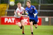 26 May 2024; Michael Finnegan of Armagh in action against Cathair McBride of Derry during the Electric Ireland Ulster GAA Football Minor Championship final match between Armagh and Derry at O'Neill's Healy Park in Omagh, Tyrone. Photo by Philip Fitzpatrick/Sportsfile